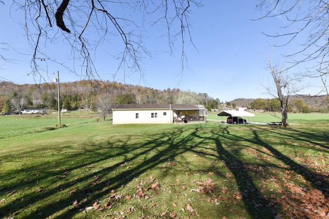 view of yard with a rural view