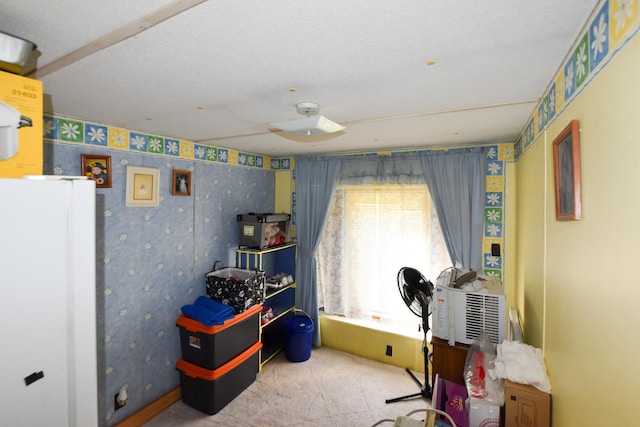 miscellaneous room featuring a textured ceiling