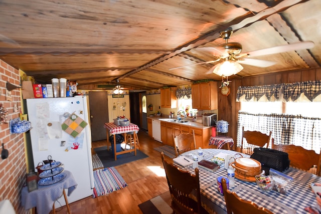 dining space featuring brick wall, ceiling fan, light wood-type flooring, and wood ceiling