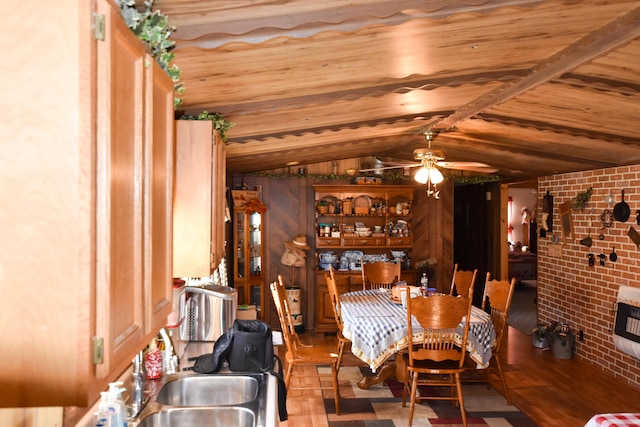 dining space with brick wall, lofted ceiling, wood ceiling, and ceiling fan