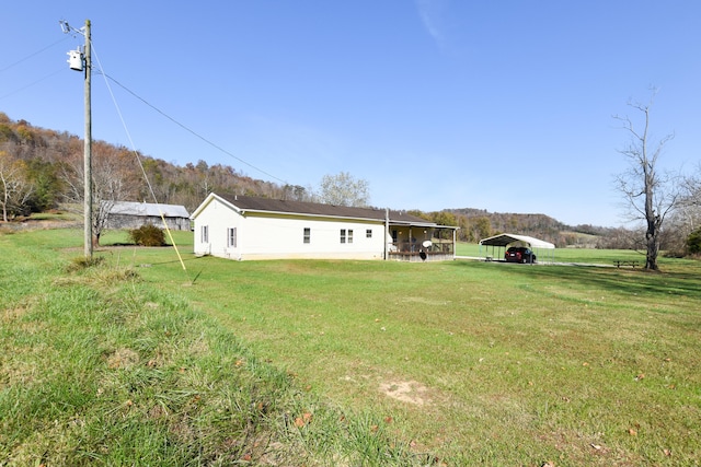 view of yard featuring a carport