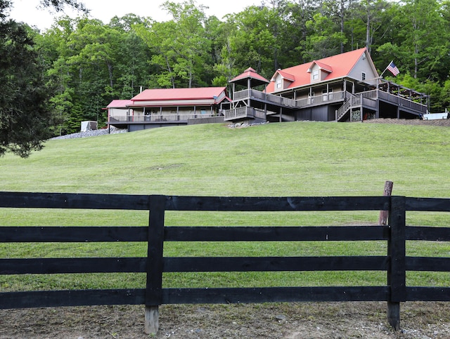 view of yard featuring a rural view and a deck