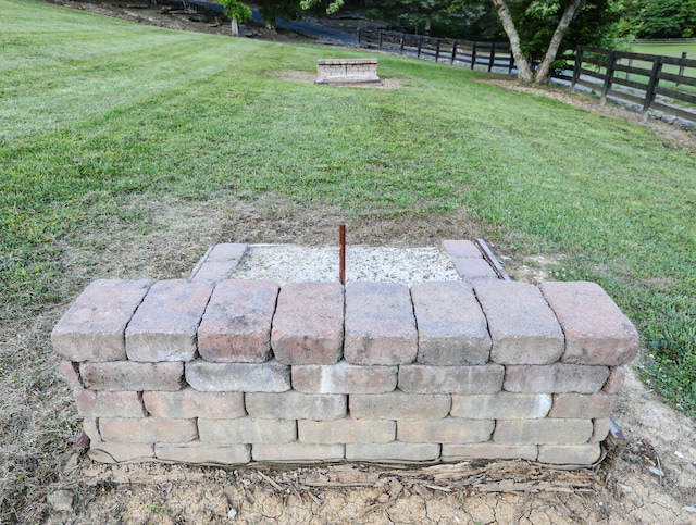 view of yard with an outdoor fire pit