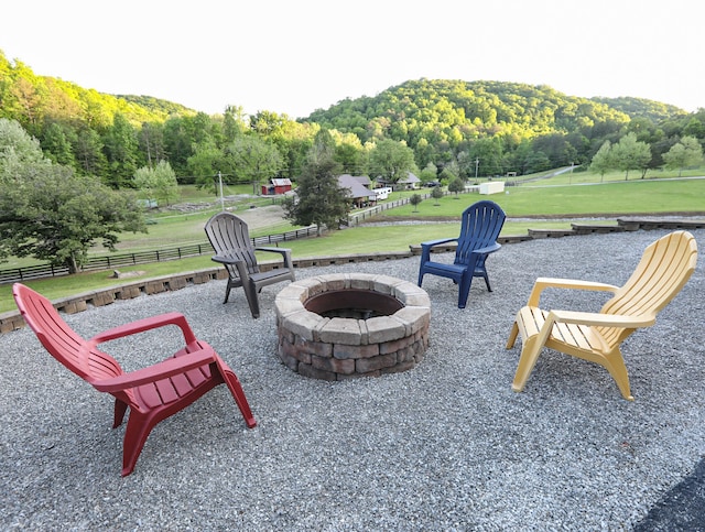 view of patio / terrace featuring a mountain view and an outdoor fire pit