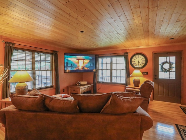 living room featuring wood ceiling, light hardwood / wood-style flooring, and crown molding