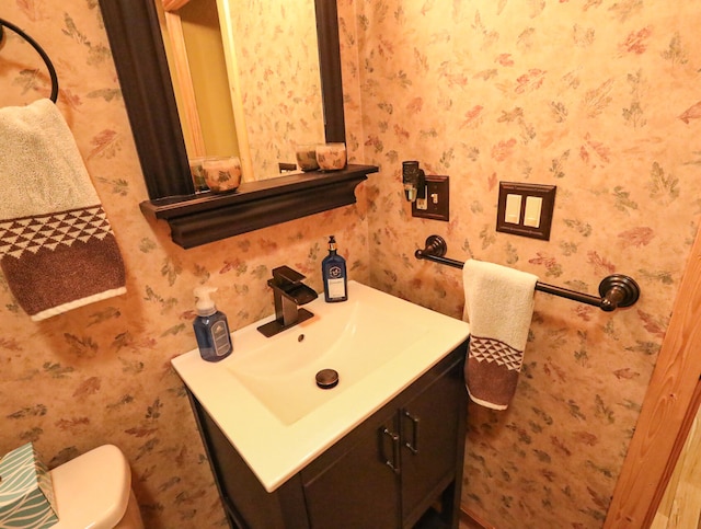 bathroom with vanity and toilet