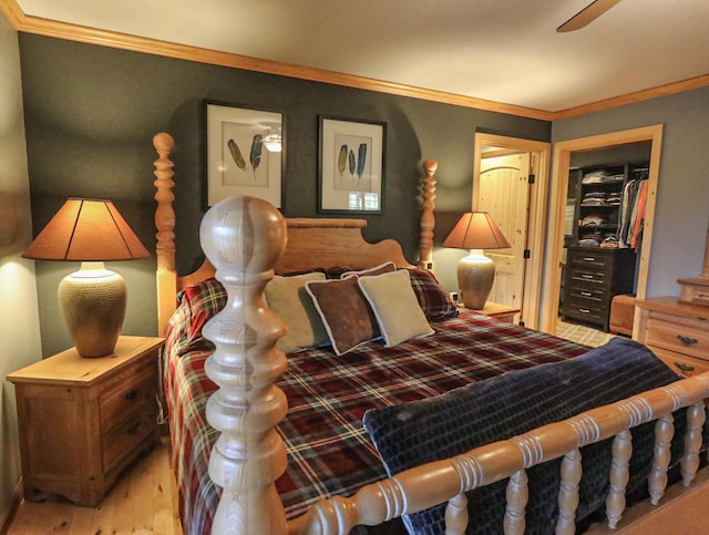 bedroom with ceiling fan and crown molding