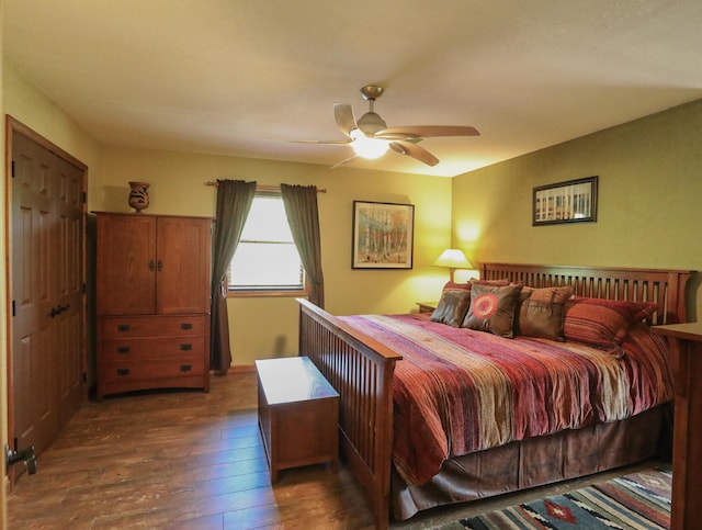 bedroom featuring ceiling fan and dark hardwood / wood-style flooring