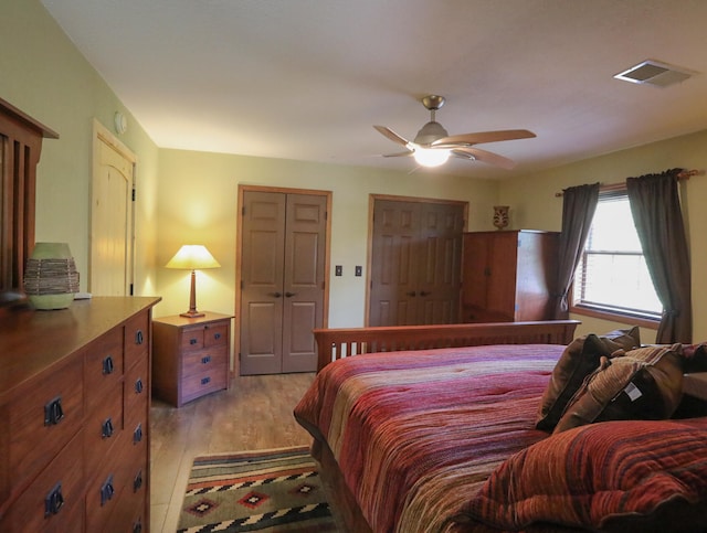 bedroom with ceiling fan and light hardwood / wood-style flooring