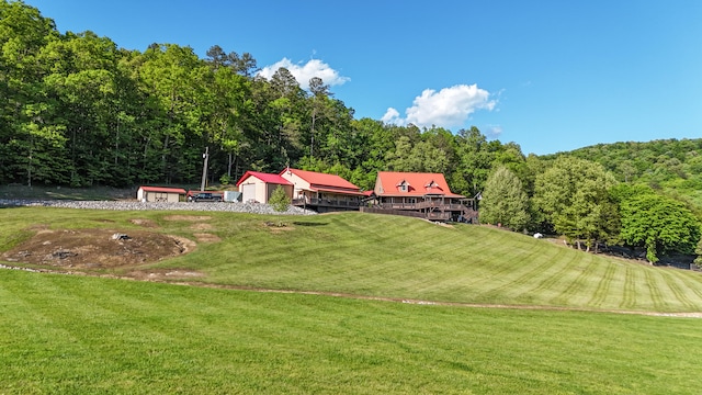 exterior space featuring a lawn and an outbuilding