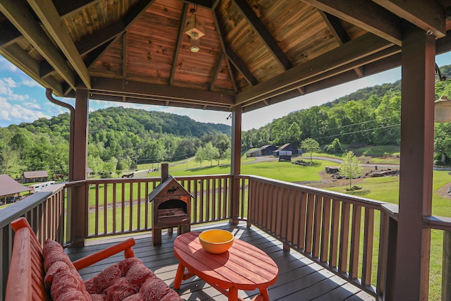 deck with a gazebo and a yard