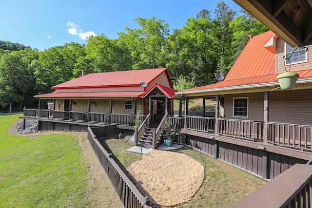 exterior space with a porch and a front yard