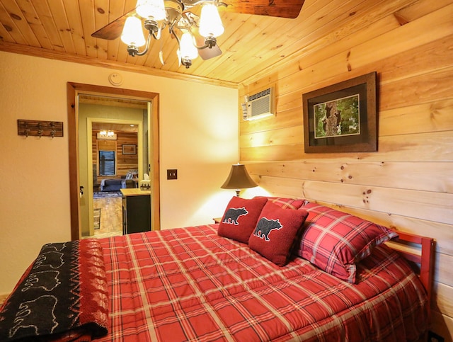 bedroom with a wall mounted AC, wooden walls, ornamental molding, and wooden ceiling