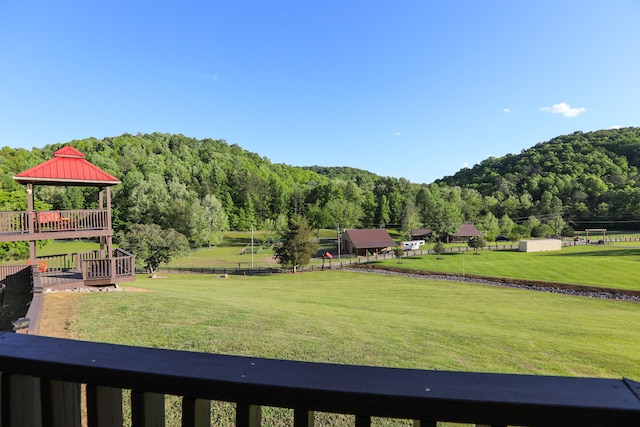 view of yard featuring a gazebo and a wooden deck