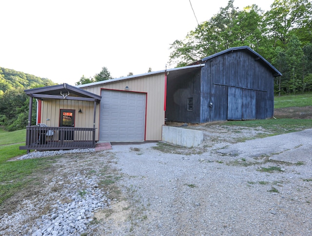 exterior space with a garage and covered porch