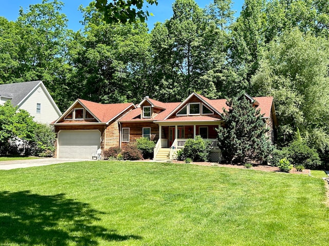 craftsman-style home with a front lawn, a garage, and a porch