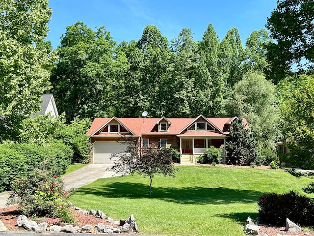 view of front of home with a front yard and a garage