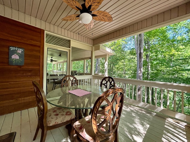 wooden deck featuring ceiling fan