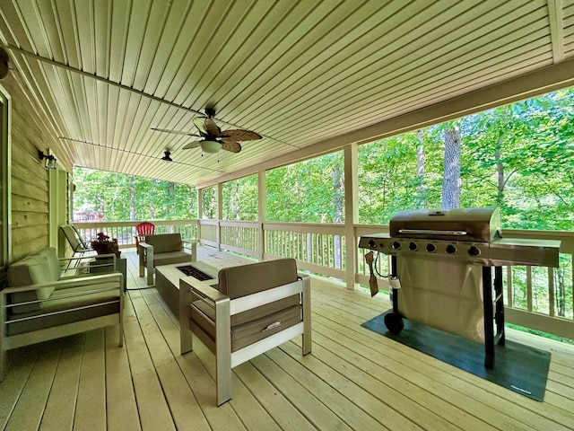 wooden deck featuring an outdoor living space, a grill, and ceiling fan