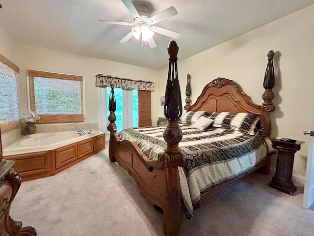 bedroom featuring light colored carpet and ceiling fan