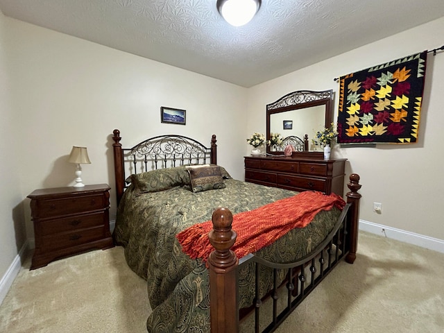 carpeted bedroom featuring a textured ceiling