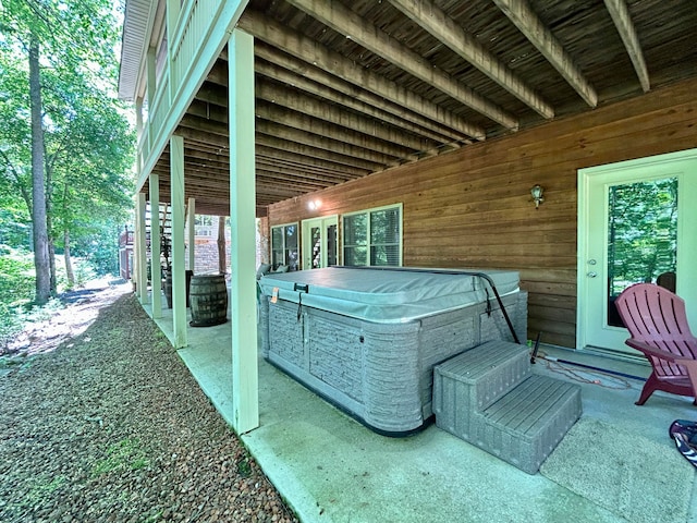 view of terrace featuring a hot tub