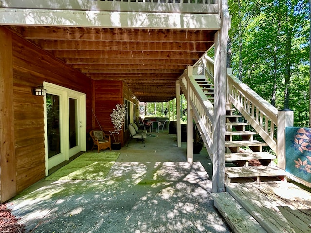 view of patio with french doors and a deck