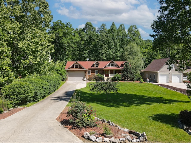 view of front of property with a garage and a front lawn