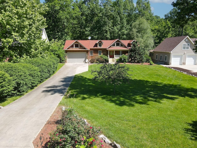 view of front facade featuring a front yard and a garage