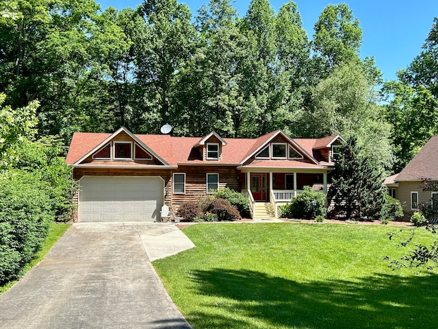 view of front of home with a garage and a front yard