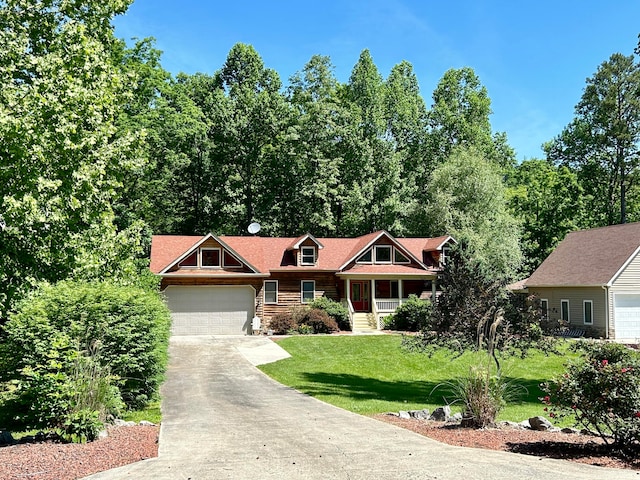 view of front of house with a garage and a front lawn