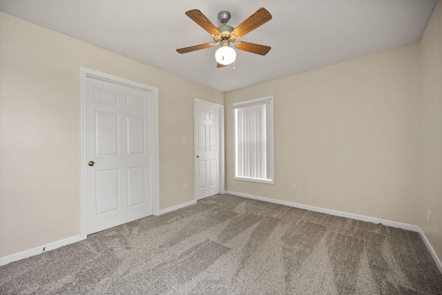 unfurnished bedroom featuring ceiling fan and carpet flooring