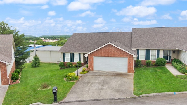 view of front of home with a garage and a front yard