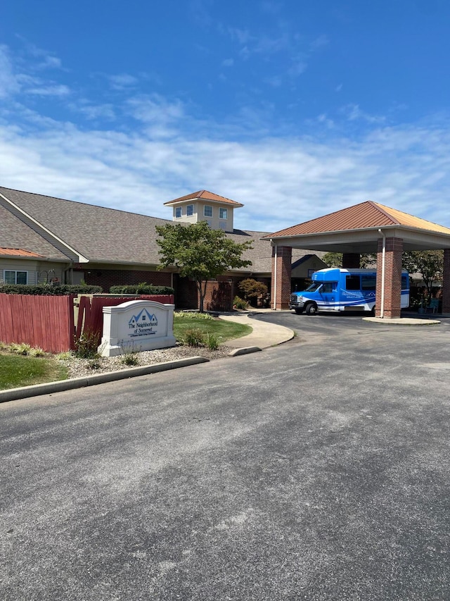 view of front facade with a carport