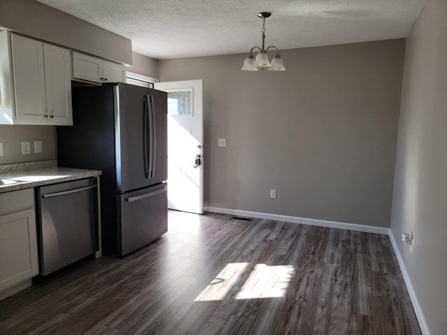 4104 Brooksville-Germantown Rd, Augusta, KY 41002 - kitchen with appliances with stainless steel finishes, dark wood finished floors, white cabinetry, a chandelier, and a textured ceiling