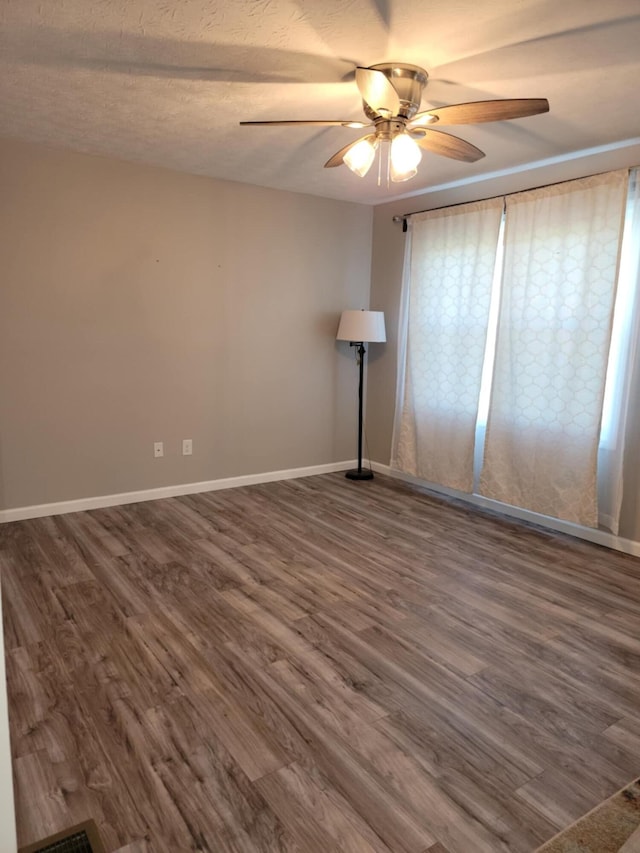 4104 Brooksville-Germantown Rd, Augusta, KY 41002 - empty room featuring ceiling fan, dark wood finished floors, and baseboards