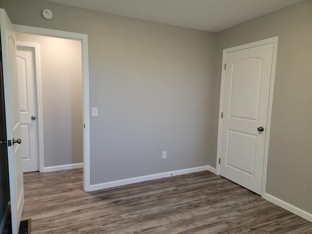 4104 Brooksville-Germantown Rd, Augusta, KY 41002 - empty room featuring wood finished floors, a smoke detector, and baseboards