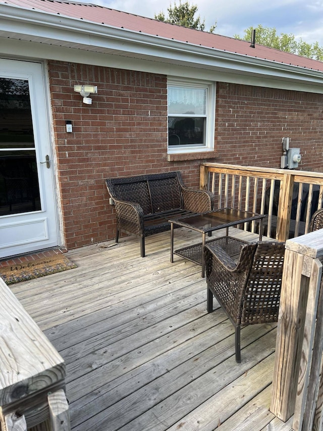 wooden terrace featuring outdoor lounge area