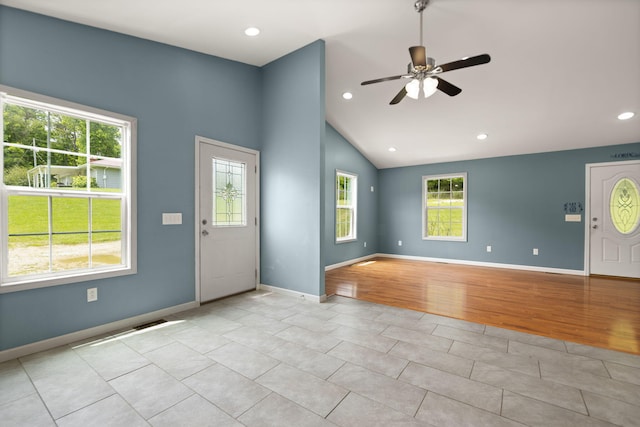 entrance foyer with vaulted ceiling, light hardwood / wood-style floors, and ceiling fan