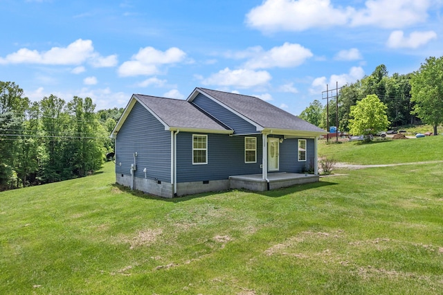 back of house with a yard