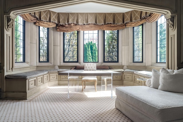 unfurnished sunroom featuring vaulted ceiling and plenty of natural light