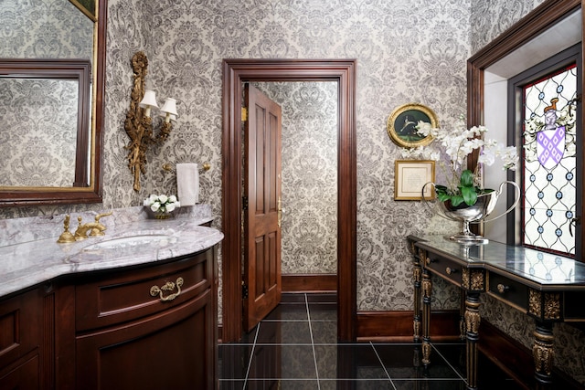 bathroom with tile patterned floors and vanity