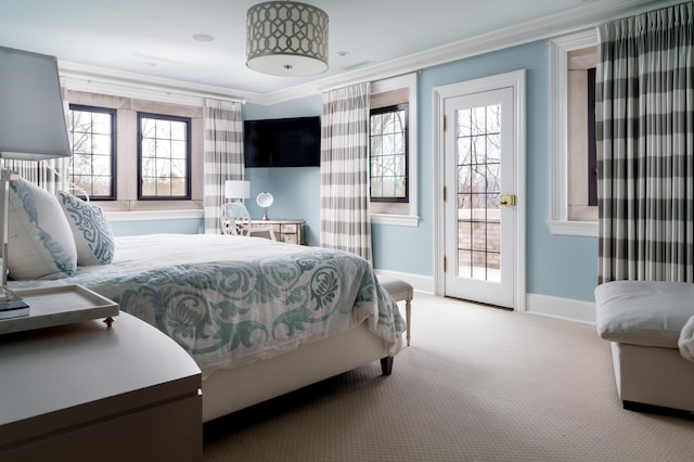 bedroom with light colored carpet and ornamental molding