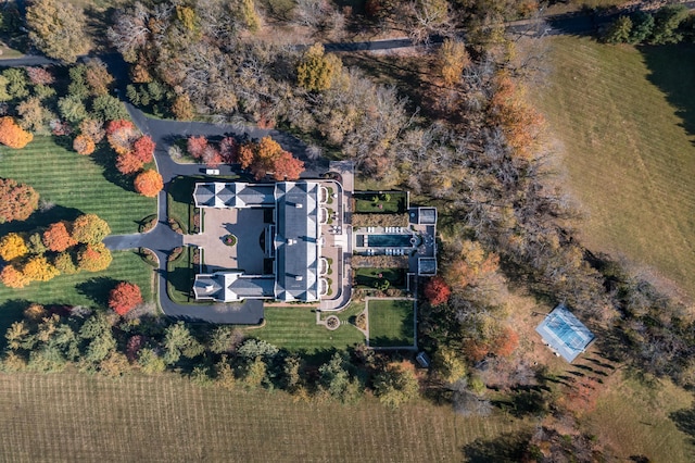 birds eye view of property with a rural view