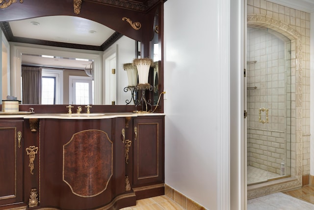 bathroom with vanity, ornamental molding, and walk in shower