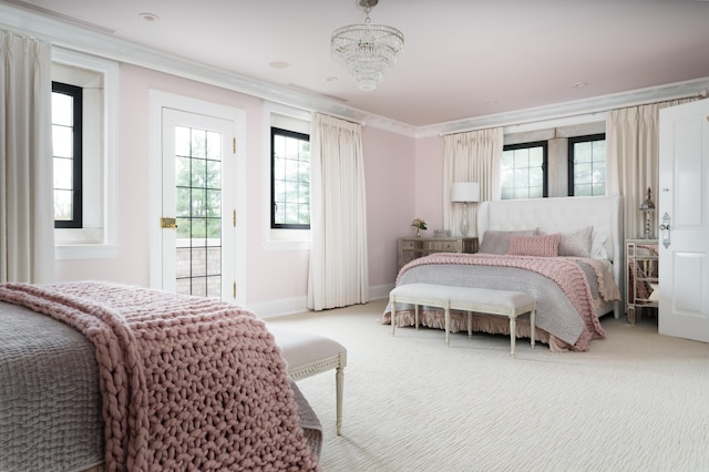 bedroom with carpet flooring, a notable chandelier, ornamental molding, and multiple windows