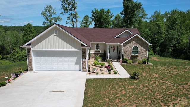 view of front of house featuring a garage and a front yard