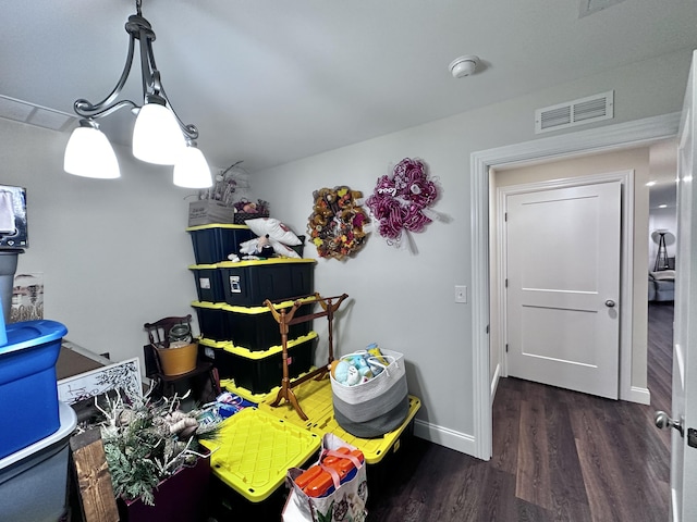 game room with dark wood-type flooring