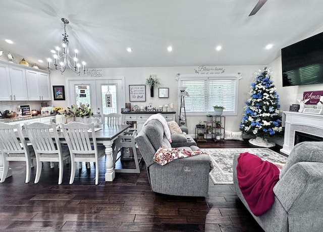 living room featuring dark hardwood / wood-style flooring, a healthy amount of sunlight, and french doors