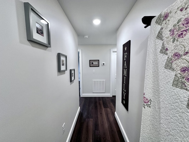 corridor with dark hardwood / wood-style floors